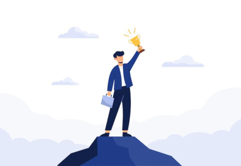 successful-business-man-holding-trophy_1150-35042